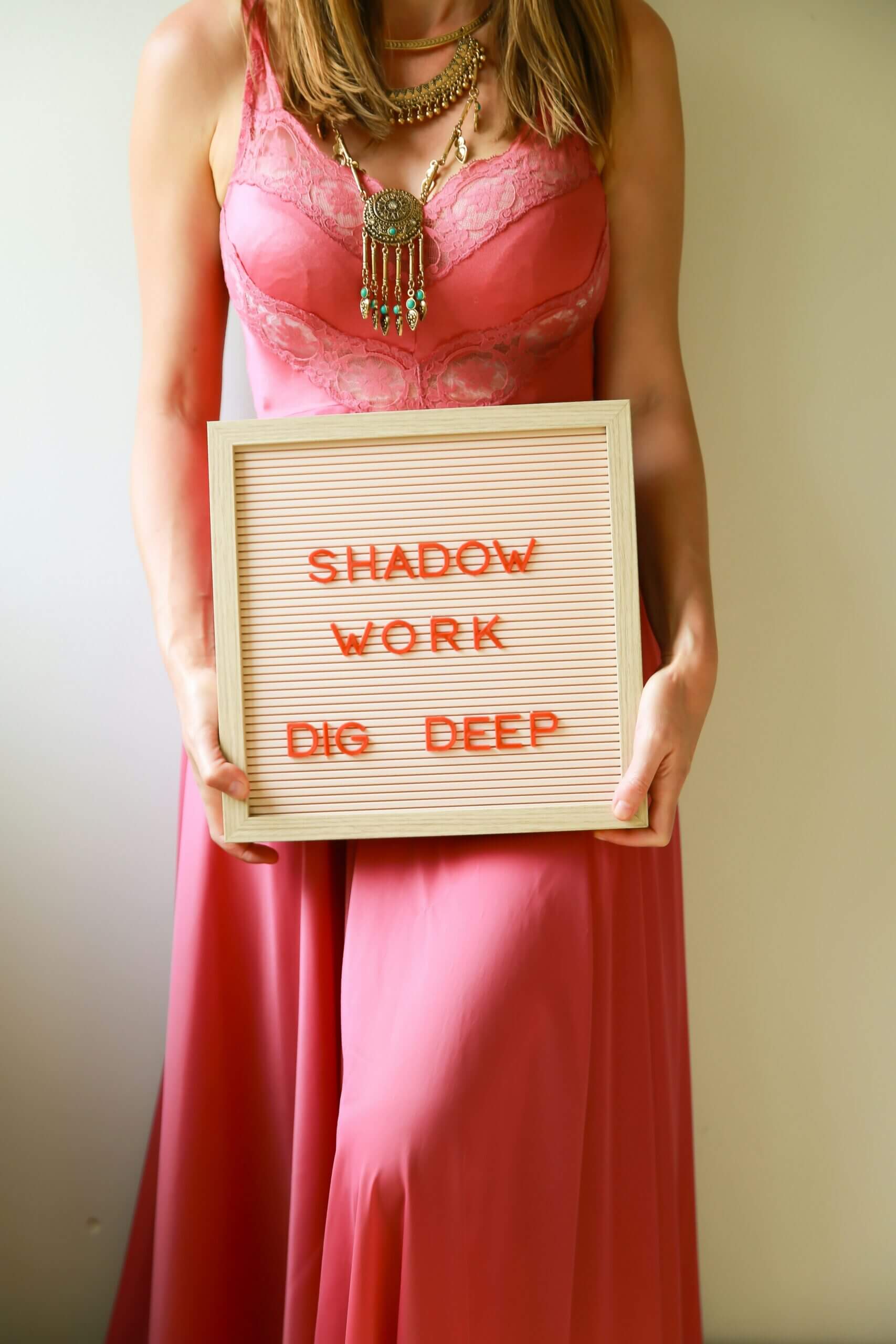 ava-sol-661tp0ShG6I-unsplash Ava Sol https://unsplash.com/@avasol on https://unsplash.com/photos/woman-holds-a-sign-about-shadow-work-661tp0ShG6I
